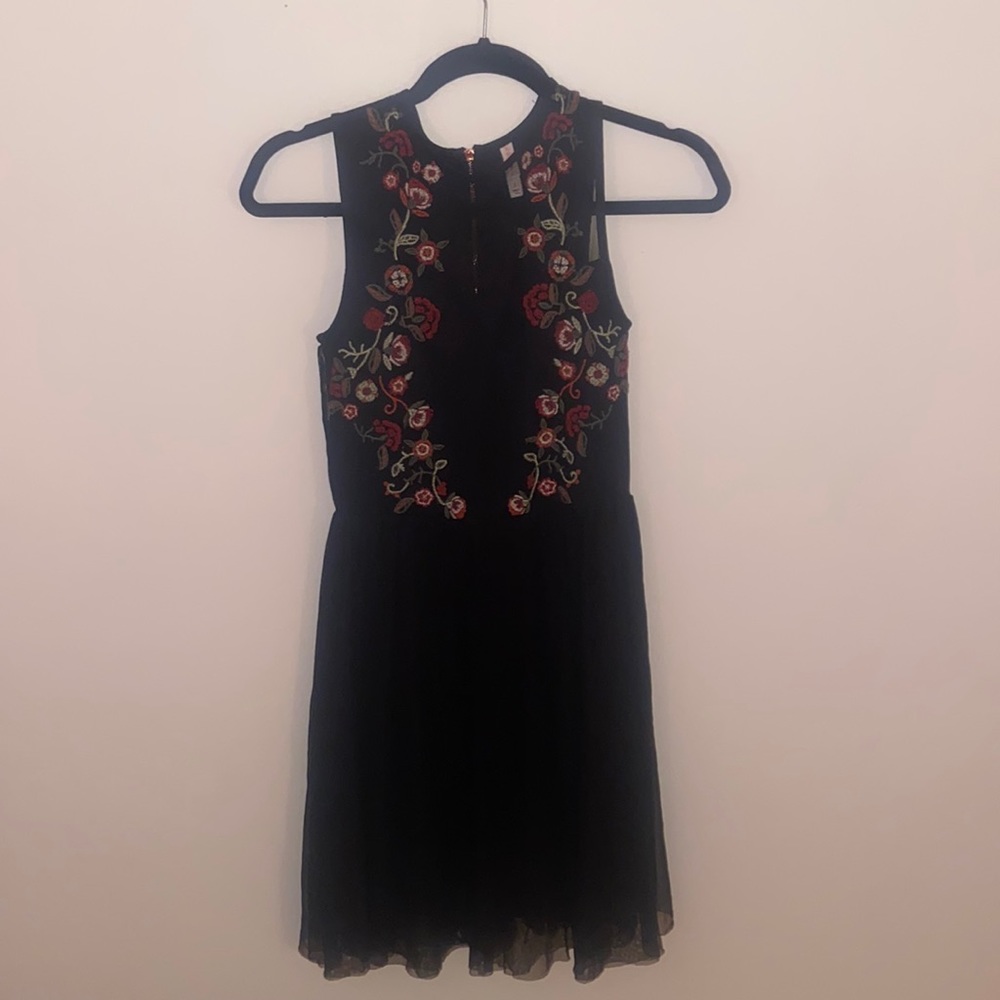 Black short formal zip-up dress with red flower detailing